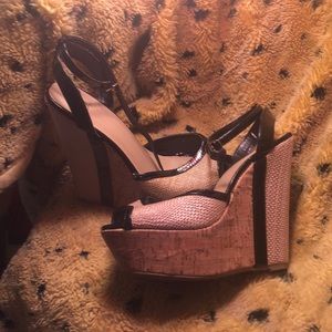 Tan and black textured wedges within detailed heel